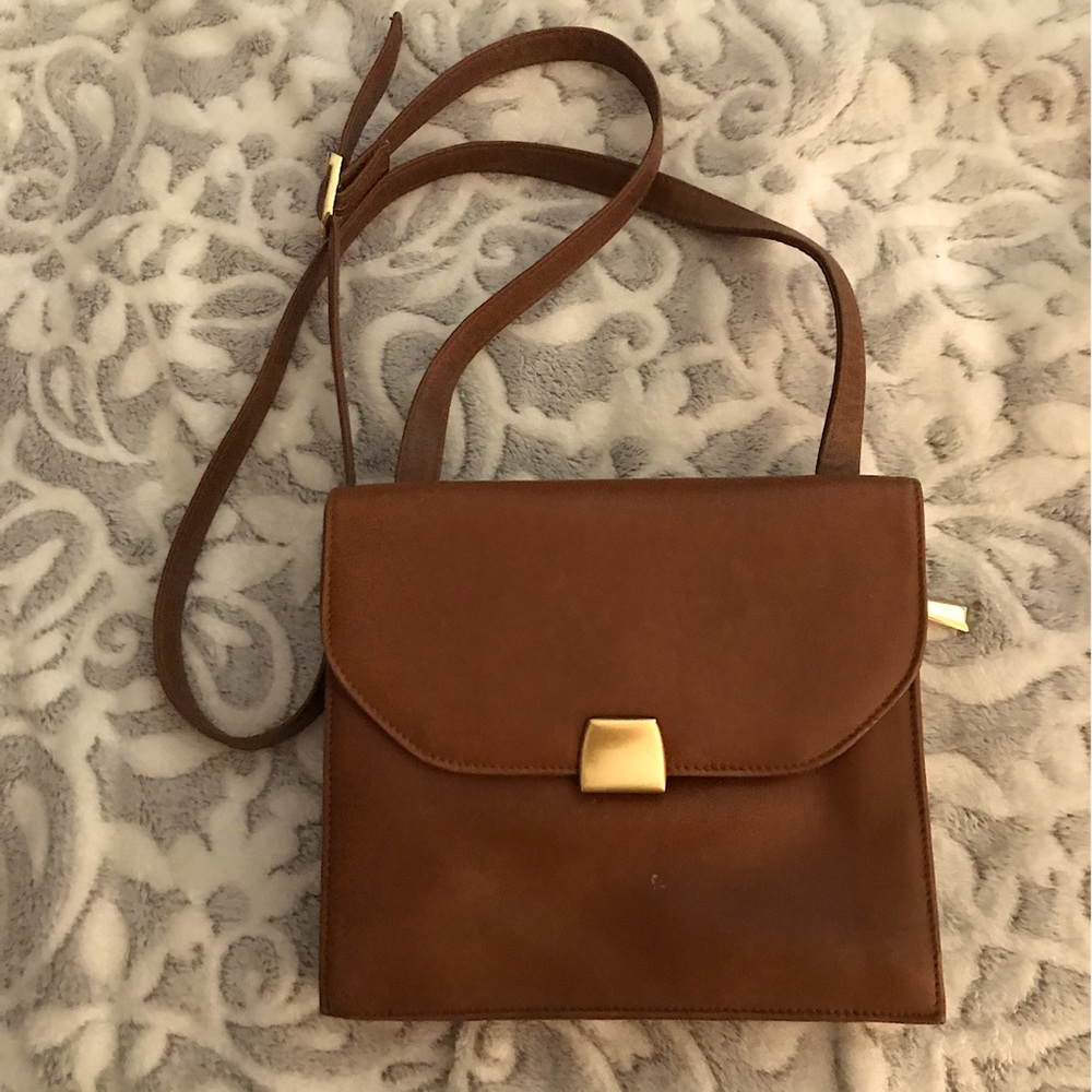 Brown crossbody purse. Opens on both sides. Five storage places. RS Collection